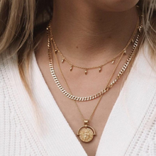 Load image into Gallery viewer, Beautiful angel pendant necklace. Perfect for layering or featured on its own. 18k gold plated Tarnish/water resistant 18&quot; Necklace Length Pendant Diameter 0.75&quot;
